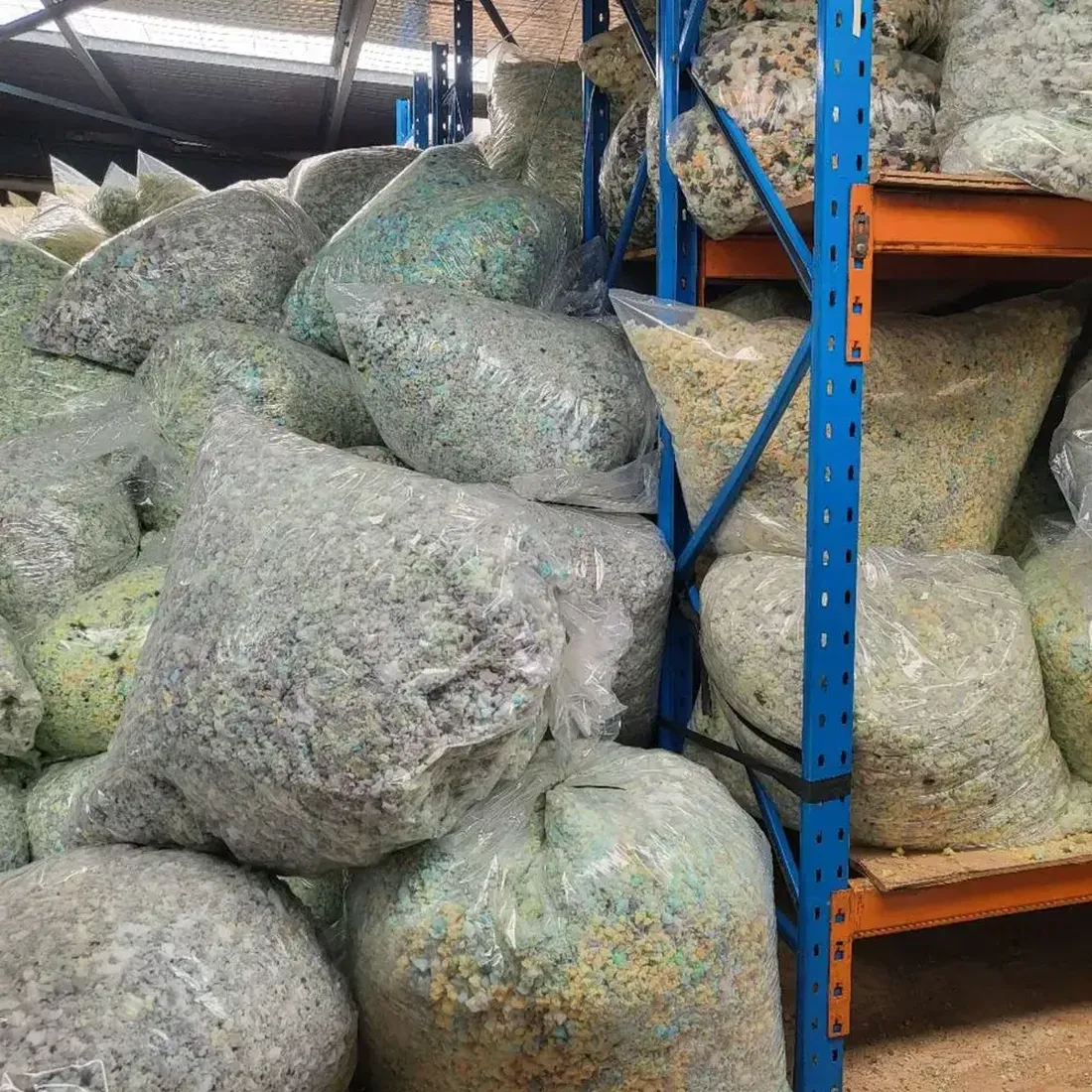 Packed bags of mixed crumbed foam filling stored in the warehouse